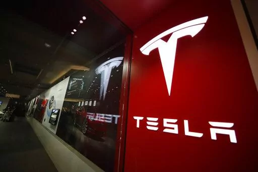 A sign bearing the Tesla company logo is displayed outside a Tesla store in Cherry Creek Mall in Denver, Colorado, Feb. 9, 2019. Mexico is undergoing competition among several states in 2023 to attract a possible Tesla facility. (AP Photo/David Zalubowski, File)