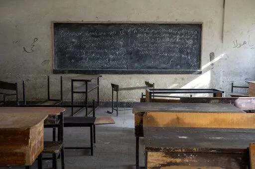 A classroom that previously was used for girls sits empty in Kabul, Afghanistan, Thursday, Dec. 22, 2022. The country's Taliban rulers earlier this week ordered women nationwide to stop attending private and public universities effective immediately and until further notice. They have banned girls from middle school and high school, barred women from most fields of employment and ordered them to wear head-to-toe clothing in public. Women are also banned from parks and gyms.(AP Photo/Ebrahim Noro