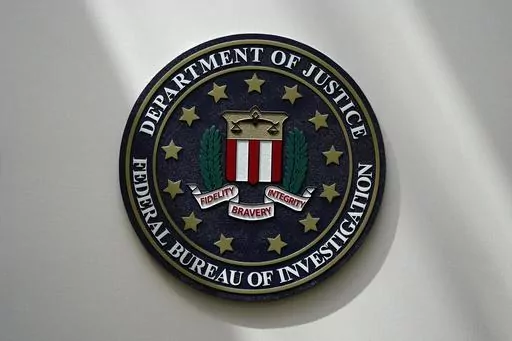 The FBI seal is pictured in Omaha, Neb., Aug. 10, 2022. FBI officials repeatedly violated their own standards when they searched a vast repository of foreign intelligence for information related to the insurrection at the U.S. Capitol on Jan. 6, 2021, and racial justice protests in 2020. That's according to a heavily blacked-out court order released Friday, May 19, 2023. FBI officials said the violations predated a series of corrective measures that started in the summer of 2021 and continued la