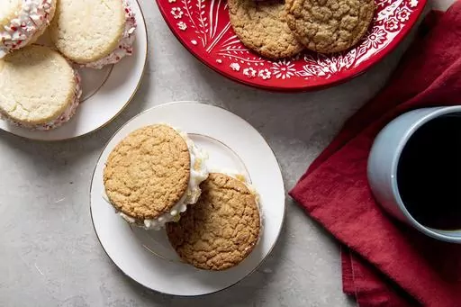 This Dec. 2018 image shows cookie ice cream sandwiches with crushed candies on the outside. (Cheyenne Cohen/Katie Workman via AP)