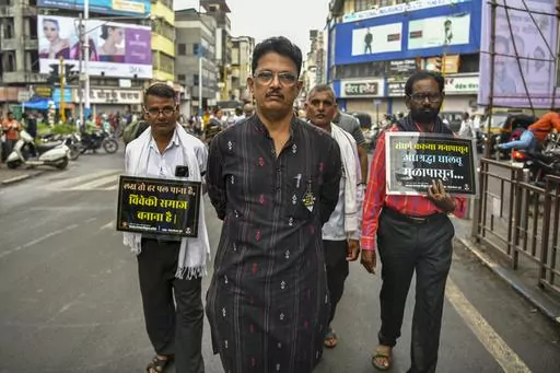 Avinash Patil, center, an activist and leader of the Maharashtra Andhashraddha Nirmulan Samiti, an anti-superstition group, marches on the 10th death anniversary of its founder and renowned rationalist, Narendra Dabholkar, who was gunned down during a morning walk in Pune, India, Sunday, Aug 20, 2023. The nones in India come from an array of belief backgrounds, including Hindu, Muslim and Sikh. The surge of Hindu nationalism has shrunk the space for the nones over the last decade, activists say.