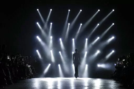 A model wears a creation as part of the Roberto Cavalli Fall/Winter 2022-2023 fashion collection, unveiled during the Fashion Week in Milan, Italy, Wednesday, Feb. 23, 2022. (AP Photo/Antonio Calanni)