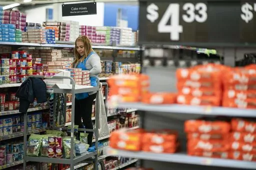 A worker organizes items at a Walmart Supercenter in North Bergen, N.J., on Feb. 9, 2023. If inflation has eaten away at your budget, then your tax refund might just provide a much-needed protective barrier. As of March, prices are up 6% over the past 12 months, according to the most recent consumer price index. At the same time, just over half of filers (55%) are expecting tax refunds for the 2022 tax year, with an average expected refund of $2,205, according to the 2023 Nerdwallet Tax Report. 