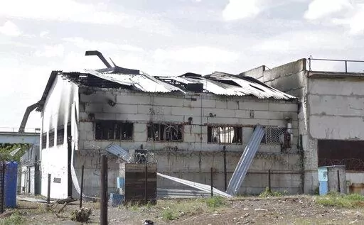 In this photo taken from video a view of a destroyed barrack at a prison in Olenivka, in an area controlled by Russian-backed separatist forces, eastern Ukraine, on July 29, 2022. Russia and Ukraine accused each other Friday of shelling a prison in a separatist region of eastern Ukraine, an attack that reportedly killed dozens of Ukrainian military prisoners who were captured after the fall of a southern port city of Mariupol in May. (AP Photo)