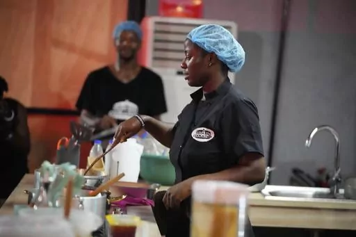 Chef Hilda Baci cooks to establish a new Guinness world record for the "longest cooking marathon", the 97-hour cook-a-thon, in Lagos, Nigeria, Thursday, May 11, 2023. A Nigerian chef on Monday continued her quest to set a new global record for the longest hours of nonstop cooking after surpassing the current record of 87 hours and 45 minutes. By 15:00 GMT on Monday, Hilda Baci had cooked for more than 97 hours, becoming a national sensation and to the cheering of many in Nigeria's commercial hub