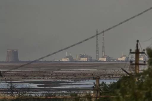 The Zaporizhzhia nuclear power plant, Europe's largest, is seen in the background of the shallow Kakhovka Reservoir after the dam collapse, in Energodar, Russian-occupied Ukraine, Tuesday, June 27, 2023. Officials at the Russian-controlled Zaporizhzhia Nuclear Power Plant said that the site was attacked Sunday April 7, 2024, by Ukrainian military drones, including a strike on the dome of the plant’s sixth power unit. (AP Photo/Libkos, File)