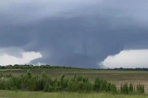 This screenshot taken from a video shows a tornado on June 14, 2023, in Blakely, Ga. Officials from Texas to Georgia are reporting damaging winds and possible tornadoes as a powerful storm system crosses the South. (Rand McDonald via AP)