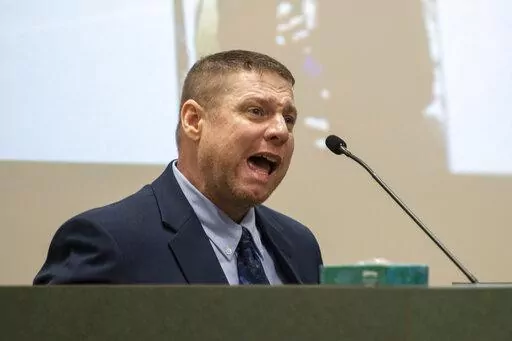 Jacob Blair Scott, who is accused of sexually assaulting a minor, cries out while being cross-examined by Assistant District Attorney Justin Lovorn during his trial in Jackson County Circuit Court in Pascagoula, Miss., on June 1, 2022. On Monday, Nov. 28, Scott was sentenced to 21 months in prison for faking his own death in Alabama to avoid criminal charges of impregnating a teenage girl in his home state of Mississippi. (Hannah Ruhoff/The Sun Herald via AP, File)