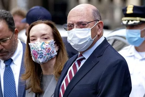 FILE — The Trump Organization's Chief Financial Officer Allen Weisselberg, awaits a car after leaving a courtroom appearance in New York, Sept. 20, 2021. Lawyers for Donald Trump's longtime finance chief are asking a judge on Tuesday, Feb. 22, 2022, to throw out tax fraud charges against him, arguing New York prosecutors targeted him as punishment because he wouldn't flip on the former president. (AP Photo/Craig Ruttle, File)