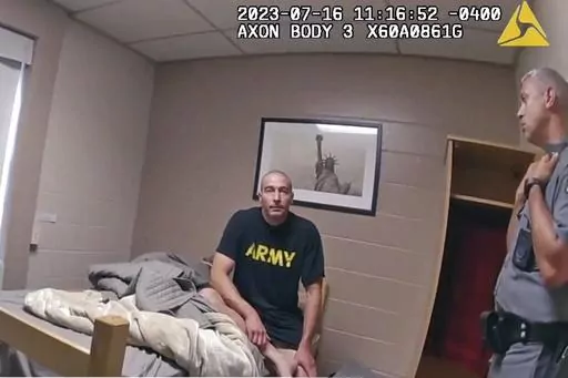 In this image taken from New York State Police body camera video that was obtained by WMTW-TV 8 in Portland, Maine, New York State police interview Army Reservist Robert Card, the man responsible for Maine's deadliest mass shooting, at Camp Smith in Cortlandt, New York on July 16, 2023. Card told state police before being hospitalized that fellow soldiers were worried about him because he was ”gonna friggin' do something,” according to police body cam video released under New York's Freedom 