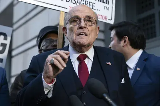 Rudy Giuliani speaks during a news conference outside federal court in Washington, Dec. 15, 2023. Giuliani has been disbarred in New York. The former New York City mayor, federal prosecutor and legal adviser to Donald Trump received the decision Tuesday, July 2, 2024 from an appeals court in Manhattan.(AP Photo/Jose Luis Magana, File)