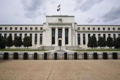 In this May 4, 2021 file photo is the Federal Reserve in Washington. Americans' financial health reached its highest level in nearly a decade last year, the Federal Reserve said Monday, May 23, 2022 spurred by a strong job market and government support payments. (AP Photo/Patrick Semansky, File)
