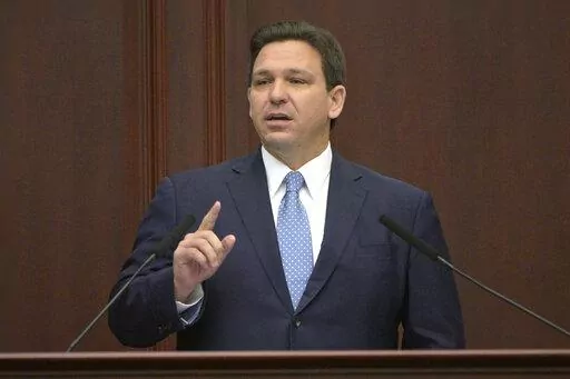 Florida Gov. Ron DeSantis addresses a joint session of a legislative session, Jan. 11, 2022, in Tallahassee, Fla. Florida Gov. DeSantis on Tuesday, April 19, asked the Legislature to repeal a law allowing Walt Disney World to operate a private government over its properties in the state, the latest salvo in a feud between the Republican and the media giant. (AP Photo/Phelan M. Ebenhack, File)