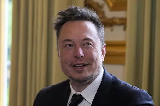 Twitter, now X. Corp, and Tesla CEO Elon Musk poses before his talks with French President Emmanuel Macron on Monday, May 15, 2023, at the Elysee Palace in Paris. A top European Union official is visiting Silicon Valley to oversee “stress tests” for Twitter before the bloc’s tough new digital rules take effect. Thierry Breton, who oversees digital policy, is the EU’s point person working to get Big Tech companies in line for the Digital Services Act, which kicks in Aug. 25. (AP Photo/Mic