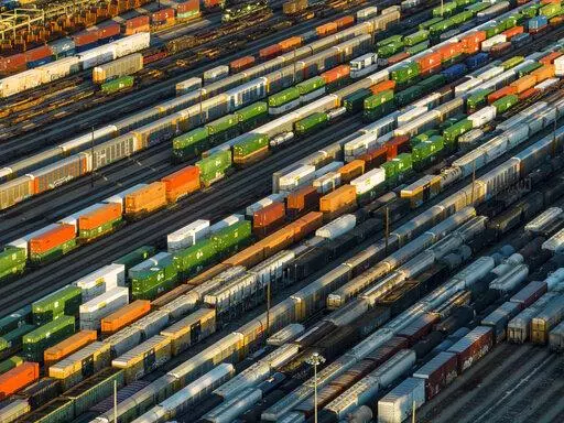 Freight train cars sit in a Norfolk Southern rail yard on Wednesday, Sept. 14, 2022, in Atlanta. President Joe Biden said Thursday that a tentative railway labor agreement has been reached, averting a strike that could have been devastating to the economy before the pivotal midterm elections. (AP Photo/Danny Karnik)