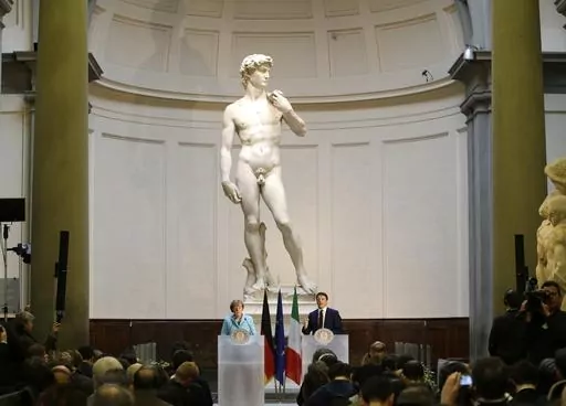German Chancellor Angela Merkel, left, and Italian Prime Minister Matteo Renzi speak during a press conference in front of Michelangelo's "David statue" after their bilateral summit in Florence, Italy, Jan. 23, 2015. A Florida charter school principal has been forced to resign after a parent complained sixth graders were exposed to pornography during a lesson on Renaissance art that included Michelangelo’s “David” sculpture. (AP Photo/Antonio Calanni, File)