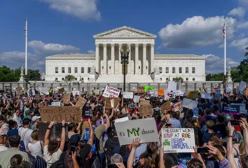 Abortion-rights and anti-abortion demonstrators gather outside of the Supreme Court in Washington, Friday, June 24, 2022. The Supreme Court has ended constitutional protections for abortion that had been in place nearly 50 years, a decision by its conservative majority to overturn the court's landmark abortion cases. (AP Photo/Gemunu Amarasinghe)