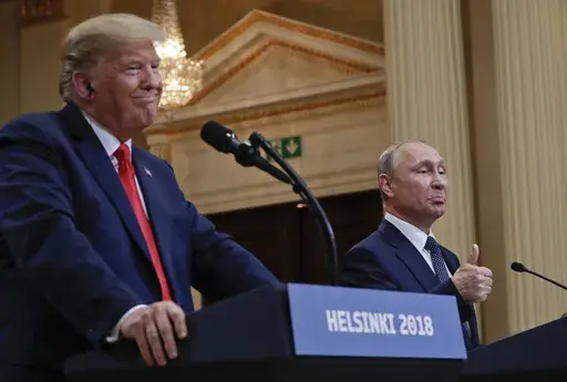 Russian President Vladimir Putin, right, and U.S. President Donald Trump give a joint news conference at the Presidential Palace in Helsinki, Finland, July 16, 2018. (AP Photo/Pablo Martinez Monsivais, File)