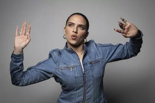Mae Muller, representing the United Kingdom in the Eurovision Song Contest poses for a photographer, in London Tuesday, March 14, 2023. (Photo by Vianney Le Caer/Invision/AP)