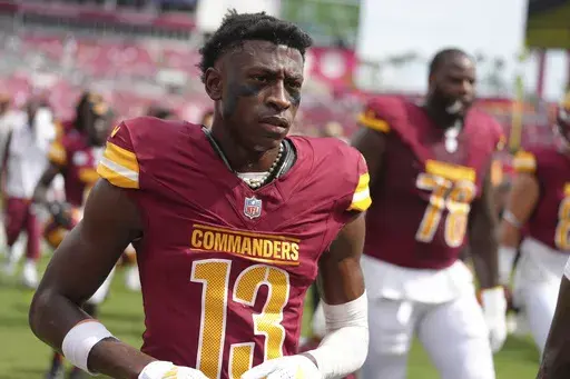 Washington Commanders cornerback Emmanuel Forbes Jr. (13) leaves the field following pregame warmups before an NFL football game against the Tampa Bay Buccaneers, Sept. 8, 2024, in Tampa, Fla. (AP Photo/Peter Joneleit, File)