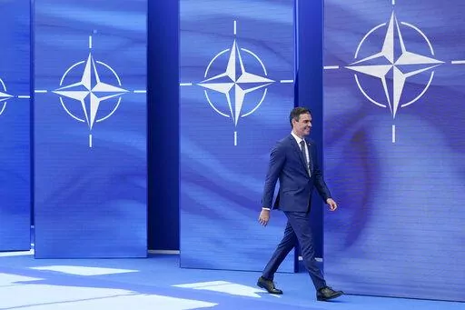 Spain's Prime Minister Pedro Sanchez arrives to pose for photos with NATO Secretary General Jens Stoltenberg at the NATO summit at NATO headquarters in Brussels, Monday, June 14, 2021. Russia’s invasion of Ukraine is certain to dominate an upcoming NATO summit in Madrid. But host nation Spain and other members are quietly pushing the Western alliance to consider how mercenaries aligned with Russian President Vladimir Putin are spreading Moscow’s influence in Africa. (AP Photo/Patrick Semansk