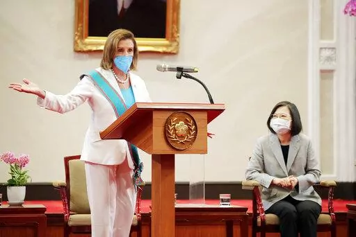 In this photo released by the Taiwan Presidential Office, U.S. House Speaker Nancy Pelosi speaks during a meeting with Taiwanese President President Tsai Ing-wen, right, in Taipei, Taiwan, Wednesday, Aug. 3, 2022. U.S. House Speaker Nancy Pelosi, meeting top officials in Taiwan despite warnings from China, said Wednesday that she and other congressional leaders in a visiting delegation are showing they will not abandon their commitment to the self-governing island. (Taiwan Presidential Office vi