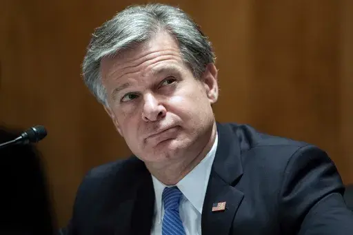 FBI Director Christopher Wray testifies on Capitol Hill in Washington, Sept. 24, 2020. (Tom Williams/Pool via AP, File)