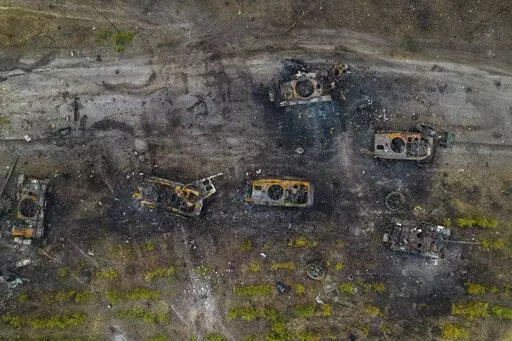 Destroyed Russian armored vehicles sit on the outskirts of Kyiv, Ukraine, Thursday, March 31, 2022. (AP Photo/Rodrigo Abd)