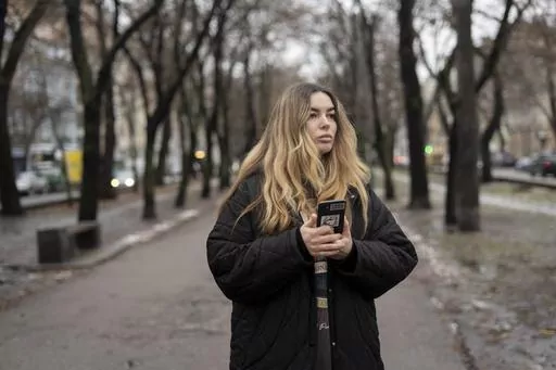 Yevheniia Synelnyk, whose brother has been in captivity for over a year and a half, stands in park in Kyiv, Ukraine, Thursday, Jan. 25, 2024. Synelnyk is also a representative of the Association of Azovstal Defenders' Families, which was created in June of 2022, shortly after around 2,500 Ukrainian servicemen surrendered to Russia on the orders of the Ukrainian president during the siege of the Azovstal steel mill in May. According to the association, around 1,500 people remain captive. (AP Phot