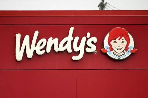 The Wendy's sign is seen at a restaurant, Jan. 23, 2023, in Pittsburgh. Wendy's is looking to test having the prices of its menu items fluctuate throughout the day based on demand, implementing a strategy that has already taken hold with ride-sharing companies and ticket sellers. (AP Photo/Gene J. Puskar, File)