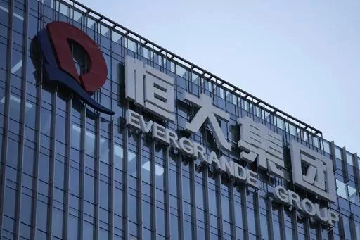 The Evergrande Group headquarters logo is seen in Shenzhen in southern China's Guangdong province on Sept. 24, 2021. Shares of debt-laden property developer China Evergrande Group soared Tuesday, Oct. 3, 2023, after they resumed trading in Hong Kong following a suspension last week. (AP Photo/Ng Han Guan, File)