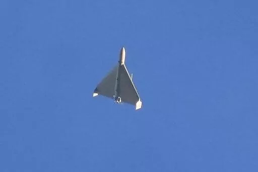 A drone is seen in the sky seconds before it fired on buildings in Kyiv, Ukraine, on Oct. 17, 2022. The Iranian-made drones that Russia sent slamming into central Kyiv this week have produced hand-wringing and consternation in Israel, complicating the country’s balancing act between Russia and the West. (AP Photo/Efrem Lukatsky)