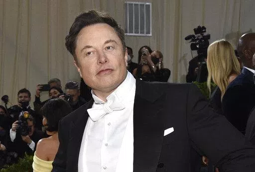 Elon Musk attends The Metropolitan Museum of Art's Costume Institute benefit gala celebrating the opening of the "In America: An Anthology of Fashion" exhibition on May 2, 2022, in New York. Twitter's stock slid more than 6% before the market open Monday, July 11, 2022, after billionaire Elon Musk announced late Friday that he will abandon his $44 billion offer to buy Twitter and the company said it will sue the Tesla CEO to uphold the deal.(Photo by Evan Agostini/Invision/AP/File)