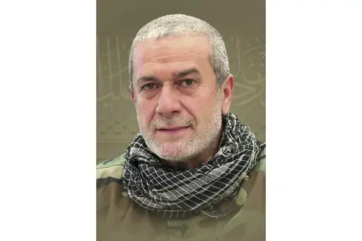 This picture released by Hezbollah media relations office, shows a portrait of Hezbollah commander Mohammad Naameh Nasser, who was killed by an Israeli airstrike that hit his car, in the southern costal town of Tyre, Lebanon, Wednesday, July 3, 2024. The strike took place as global diplomatic efforts have intensified in recent weeks to prevent escalating clashes between Hezbollah and the Israeli military from spiralling into an all-out war that could possibly lead to a direct confrontation betwe
