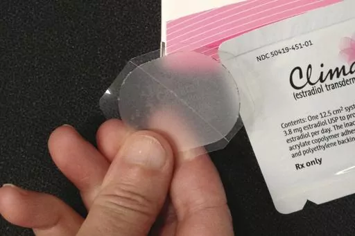 This Tuesday, Oct. 2, 2012 photo shows a low-dose estrogen skin patch. Women often use hormone therapy to relieve hot flashes and other menopause symptoms — and new research suggests whether they choose pills, patches or creams might matter for their blood pressure. The findings were published in the journal Hypertension on Monday, June 5, 2023. (AP Photo/File)