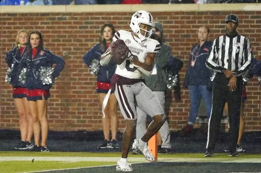 Mississippi State wide receiver Rara Thomas (0) catches a 22-yard touchdown pass during the team's NCAA college football game against Mississippi in Oxford, Miss., Thursday, Nov. 24, 2022. Mississippi State won 24-22. (AP Photo/Rogelio V. Solis)