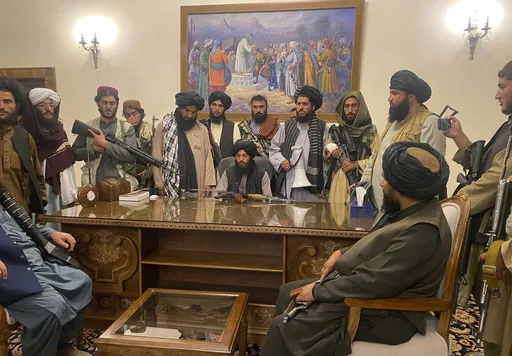 Taliban fighters take control of the Afghan presidential palace after Afghan President Ashraf Ghani fled the country, in Kabul, Afghanistan, on Aug. 15, 2021. (AP Photo/Zabi Karimi, File)