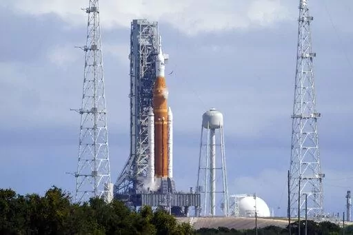 The NASA moon rocket for the Artemis mission stands on Pad 39B at the Kennedy Space Center Wednesday, Sept. 21, 2022. A hydrogen leak was detected on the rocket during a tanking test this morning. (AP Photo/John Raoux)
