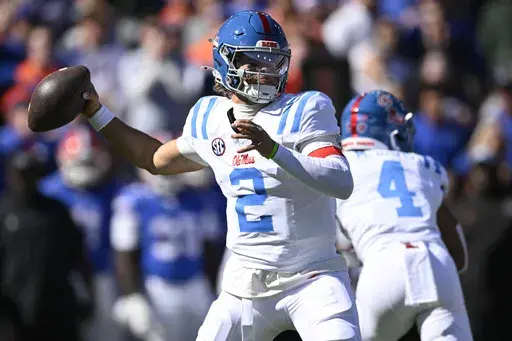Mississippi quarterback Jaxson Dart (2) throws a pass against Florida during the first half of an NCAA college football game, Saturday, Nov. 23, 2024, in Gainesville, Fla. (AP Photo/Phelan M. Ebenhack)