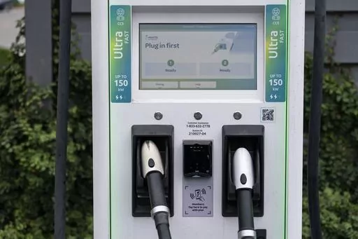 A charging station with Combined Charging System (CCS) plugs is seen in Anaheim, Calif., Friday, June 9, 2023. Owners of General Motors and Ford electric vehicles will be able charge at many of Tesla's large network of stations across the U.S. starting next year. (AP Photo/Jae C. Hong)