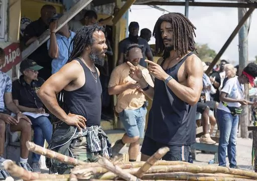 This image released by Paramount Pictures shows producer Ziggy Marley, left, and Kingsley Ben-Adir on the set of "Bob Marley: One Love." (Chiabella James/Paramount Pictures via AP)
