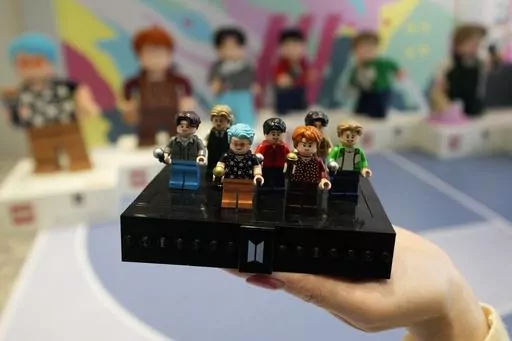 A LEGO set made of its blocks featuring K-pop band BTS, is shown during a publicity event at a store in Seoul, South Korea, on March 2, 2023. Danish toymaker Lego said Monday Sept. 25, 2023 that an experiment to make its colorful building bricks out of recycled drinks bottles didn’t work but the world’s largest toymaker “remains committed” to its plans to find sustainable materials to reduce carbon emission. (AP Photo/Lee Jin-man, File)