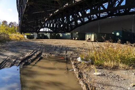Dumpsters are stored under the Pulaski Skyway on Nov. 19, 2021, on the site of a former landfill where a new FBI investigation is taking place as a possible location where Teamsters union boss Jimmy Hoffa is buried in Jersey City, N.J. The FBI found no evidence of Hoffa during a search of land under the New Jersey bridge, a spokeswoman said Thursday, July 21, 2022. (AP Photo/Corey Sipkin, File)