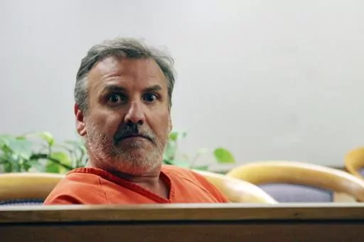 Brian Steven Smith sits in a courtroom while waiting for his arraignment to start in Anchorage, Alaska, Oct. 16, 2019. The double murder trial of Smith, a South Africa native accused of killing two Alaska Native women will begin this week, more than four years after a woman provided police with a digital memory card that authorities said contained images and video of one of the killings. (AP Photo/Mark Thiessen, File)