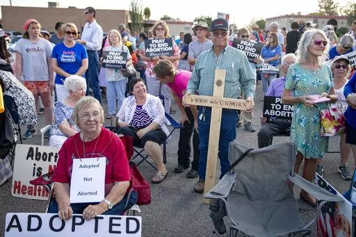 Anti-abortion advocates listen to various speakers during the Emergency Pro-Life Rally for New Mexico in Las Cruces, N.M., on Tuesday, July 19, 2022. Anti-abortion activists from across the country converged in southern New Mexico on Tuesday to protest relocation plans by the Mississippi clinic at the center of the court battle that overturned Roe v. Wade, but New Mexico's governor vowed not to back down from her support for access to abortions. (Meg Potter/The Las Cruces Sun News via AP)