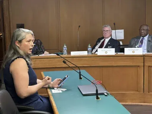 Georgia state employee Carrie Scott speaks against of a bill that would cut off public funding of transgender care by Georgia state government on Tuesday, Feb. 4, 2025 at the Georgia Capitol in Atlanta. (AP Photo/Jeff Amy)