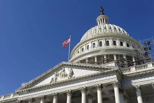 An American flag flies over Capitol Hill in Washington, Sept. 6, 2016. The United States dropped out of the top 25 for the first time to 27th place in the Transparency International’s 2021 Corruption Perceptions Index, which measures the perception of public sector corruption. The closely watched study finds that most countries have made little to no progress in bringing down corruption levels over the past decade. (AP Photo/Susan Walsh, File)