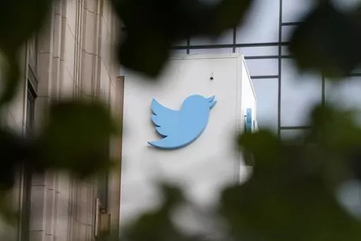 A sign at Twitter headquarters is shown in San Francisco, Dec. 8, 2022. Twitter has quietly removed a policy against the “targeted misgendering or deadnaming of transgender individuals,” raising concerns that the Elon Musk-owned platform is becoming less safe for marginalized groups. (AP Photo/Jeff Chiu, File)