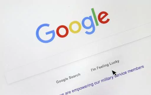 A cursor moves over Google's search engine page, Aug. 28, 2018, in Portland, Ore. Good news for all the password-haters out there: Google has taken a big step toward making them an afterthought by adding “passkeys” as a more straightforward and secure way to log into its services. (AP Photo/Don Ryan, File)