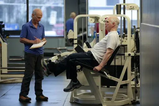 Dr. Grover Smith, right, works out with exercise scientist Dr. Irv Rubenstein, left, at STEPS Fitness, Wednesday, Feb. 12, 2025, in Nashville, Tenn. (AP Photo/George Walker IV)